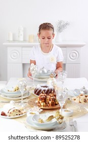 Cute Girl Setting Table For Christmas