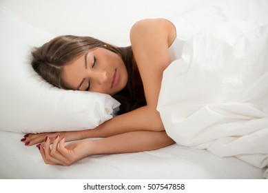 Cute Girl Sleeping In The Bed.