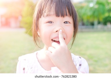 cute girl smile happily in the park