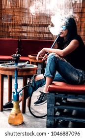 Cute Girl Smoking Shisha Outside In A Bar