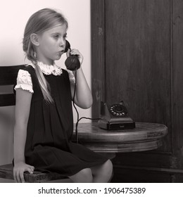 Cute Girl Speaking Via Vintage Phon