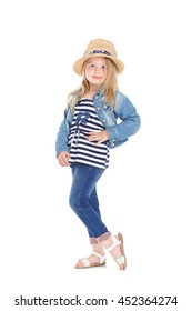 cute girl in a striped shirt and hat posing. child smiling