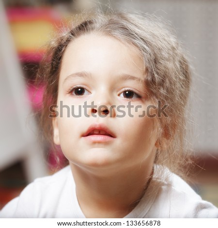 Similar – Funny child looking at the camera and painting