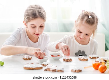 Cute Girls Decorating Easter Cookies