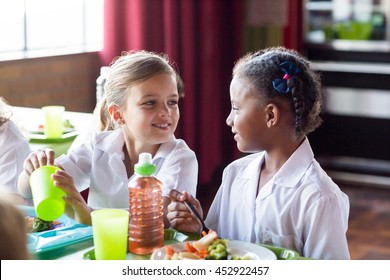 Cute Girls Having Food In School Canteen