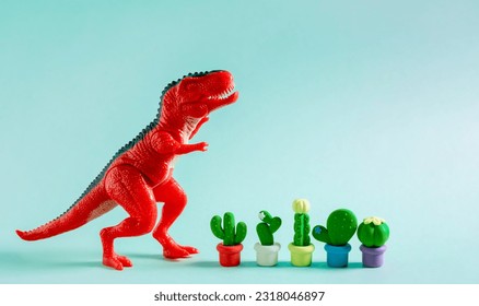 Cute greeting card with red dinosaur and cacti on blue background. Creative gardening concept - Powered by Shutterstock