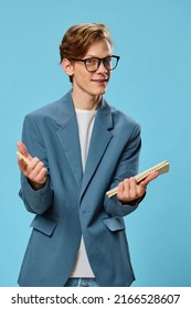 Cute Guy In Glasses And A Classic Suit Takes Notes In A Notebook