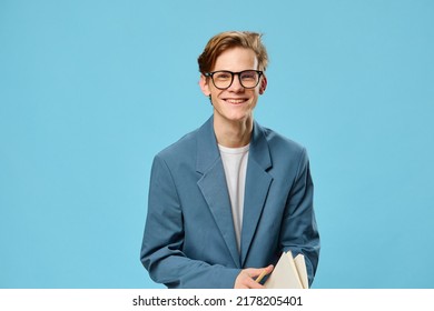 Cute Guy In Glasses And A Classic Suit Takes Notes In A Notebook