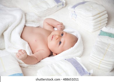 Cute Happy Baby In Diaper Lying