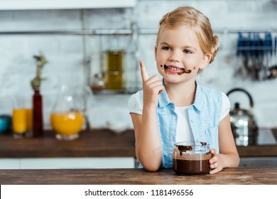 Cute Happy Child Eating Sweet Chocolate Spread