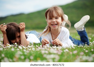 Cute Happy Children Playing In Spring Filed