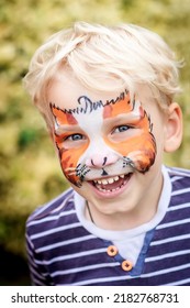 Cute Happy And Excited Little Boy With Face Paint. Face Painting, Kid Painting Face At The Birthday Party Or On Holidays