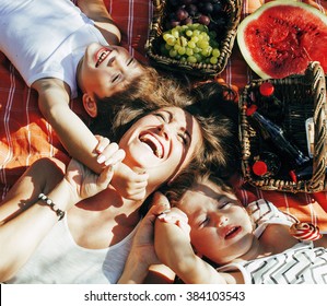 Cute Happy Family On Picnic Laying On Green Grass Mother And Kids, Warm Summer Vacations Close Up, Brother And Sister