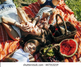 Cute Happy Family On Picnic Laying On Green Grass Mother And Kids, Warm Summer Vacations Close Up, Brother And Sister