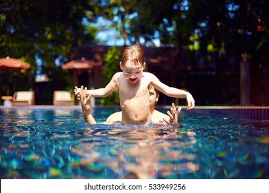 Cute Happy Kid Are Going To Jump In Pool With The Help Of His Dad, Tropical Vacation