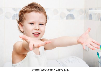 Cute Happy Kid Showing Clean Hands He Washed In Bathroom