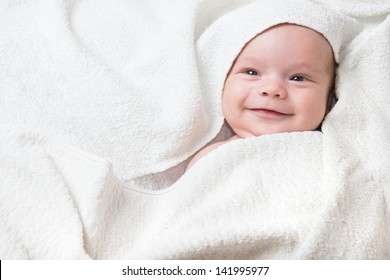 Cute Happy Little Baby Hidden In White Towels After Bath