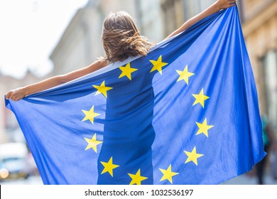 Cute Happy Young Girl With The Flag Of The European Union.