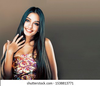 cute happy young indian woman in studio close up smiling, fashio