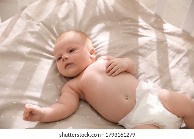 Cute Healthy Baby Lying In Cot, View From Above.