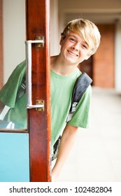 Cute High School Boy Behind Classroom Door