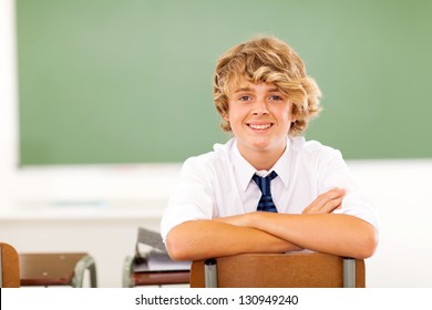 Cute High School Student Sitting In Classroom