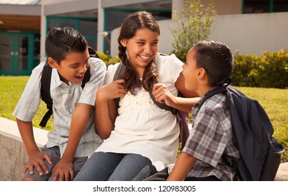 Cute Hispanic Brothers And Sister Talking Ready For School On Morning.