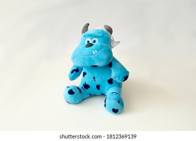 Cute horror monster from story blue toy shot on white background. Small toy for children. 