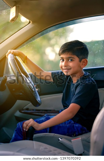 Cute Indian child in
car