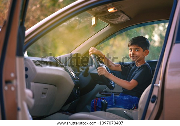 Cute Indian child in\
car