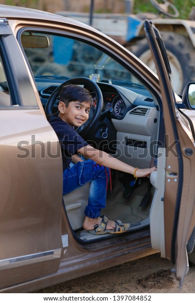 Cute Indian child in\
car