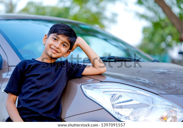 Cute Indian child with\
car