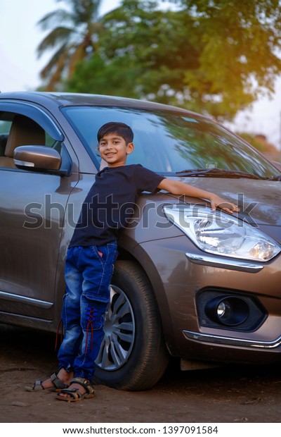 Cute Indian child with\
car