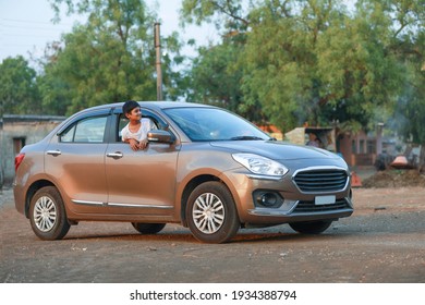 Cute Indian Child Waving From Car Window