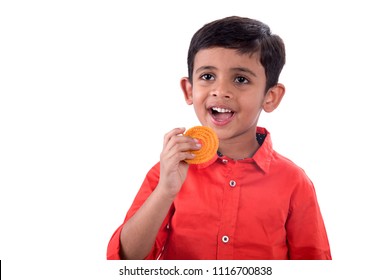 Cute Indian Kid Eating Murukku Or Chakli 