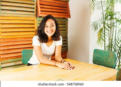 cute indonesian young woman posing at home