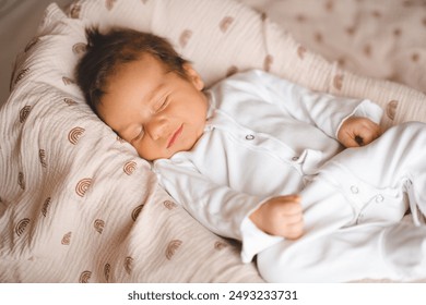 Cute infant baby boy 1-2 moths old smiling sleeping in nest close up. Childhood.  - Powered by Shutterstock