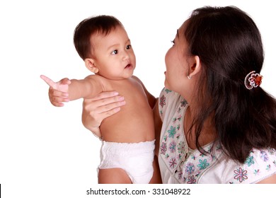 Cute Innocent Baby Pointing Finger And Nagging To Her Mom With Serious Face, Isolated On White Background