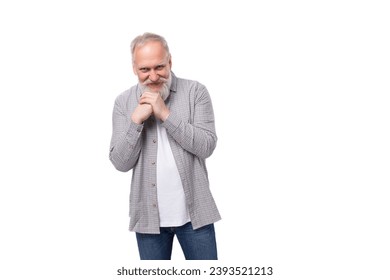 cute inspired active grandfather with white beard and mustache dressed in striped shirt and jeans - Shutterstock ID 2393521213