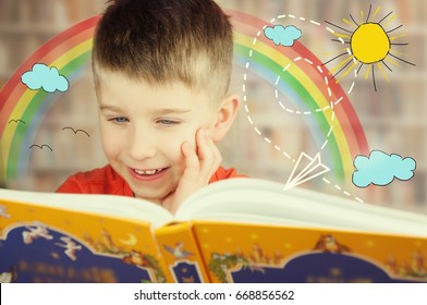 Cute Kid Boy Is Reading A Book