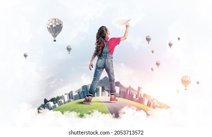 Cute Kid Girl On City Floating Island Throwing Paper Plane