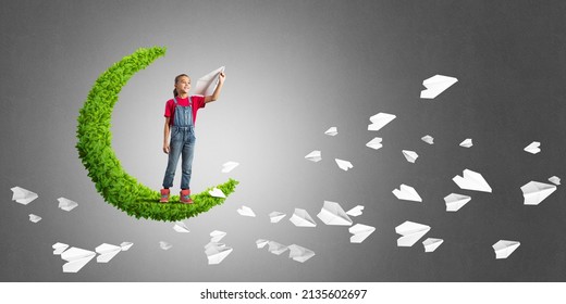 Cute Kid Girl Standing On Green Moon Throwing Paper Plane