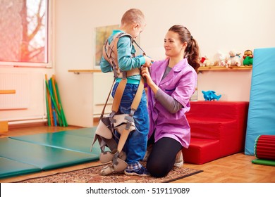 cute kid is going to have physical musculoskeletal therapy in rehabilitation center
