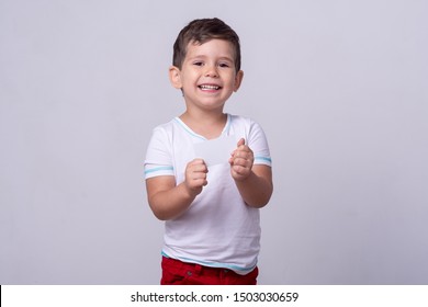 Cute Kid Holding Discount White Card In  Hand. Kid With Credit Card. Little Boy Showing Empty Blank Paper Note Copy Space.