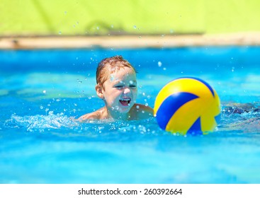 cute kid playing water sport games in pool