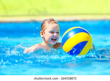 Cute Kid Playing In Water Sport Games In Pool