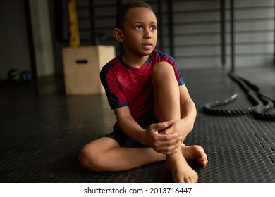 Cute kid posing for sports school album, photoshot in gym, roll of honor. Latino american boy making progress in sport, future champion. Sport career, success, professional sportsman concept