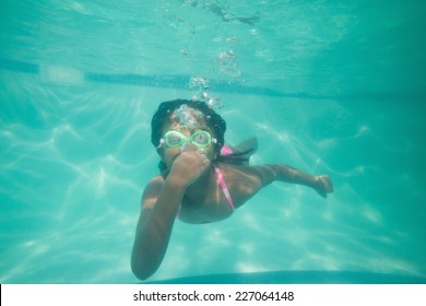 Cute Kid Posing Underwater In Pool At The Leisure Center