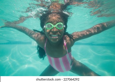 Cute Kid Posing Underwater In Pool At The Leisure Center