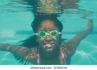 Cute Kid Posing Underwater In Pool At The Leisure Center